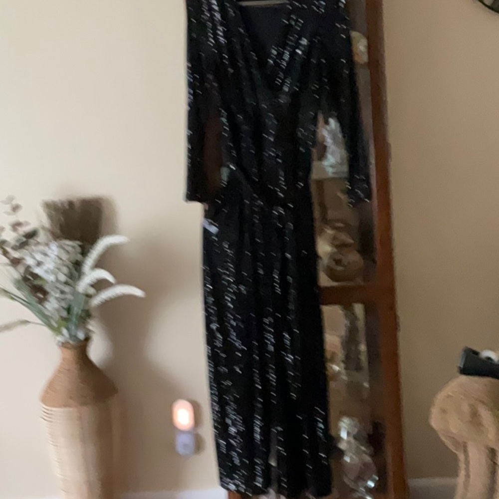 Fully lined and a bit of spandex with tie belt.  Beautiful beading.